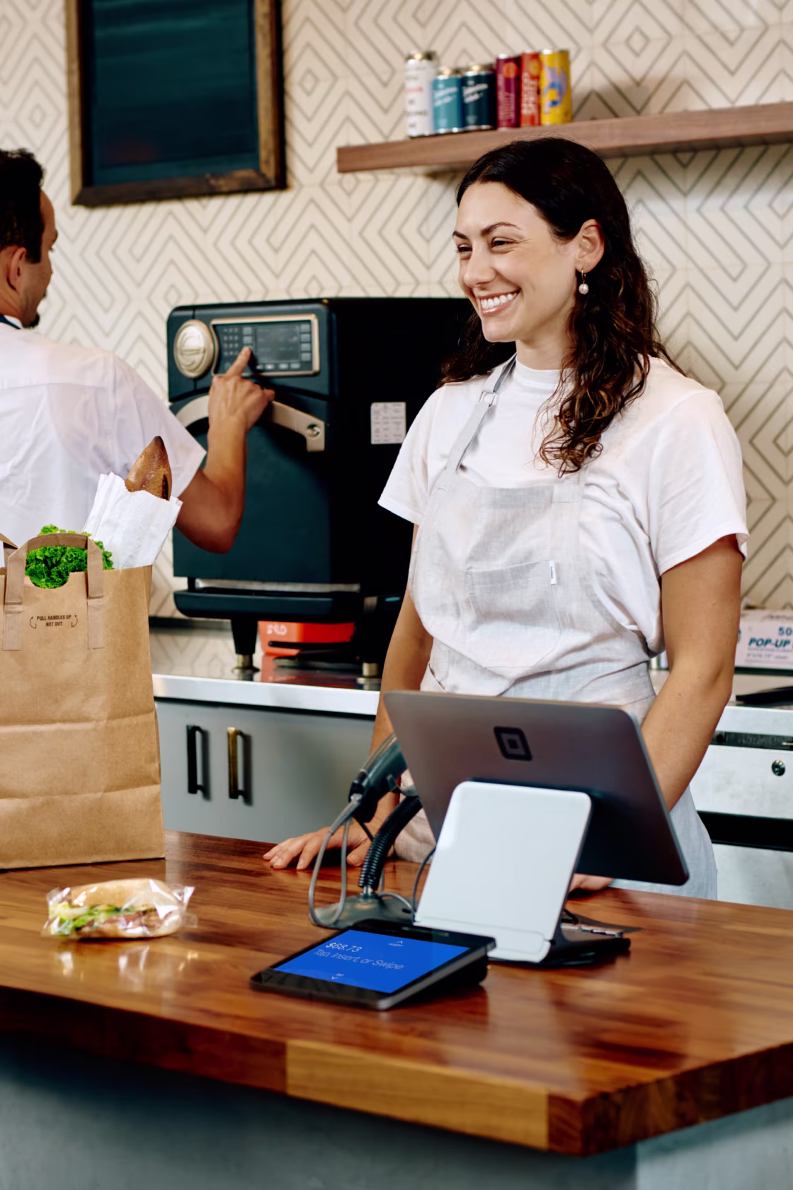 Business owner using a modern checkout system